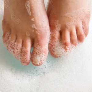 Washing feet with soapy water