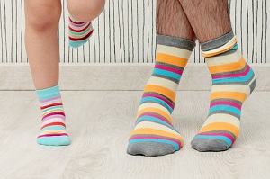 Man and child in colorful striped socks