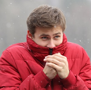 Man shivering with cold